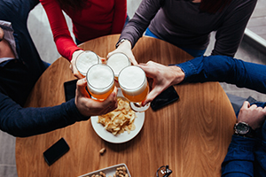 Friends Toasting In A Tavern