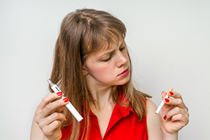 Woman with Cigarette & Vaporizer